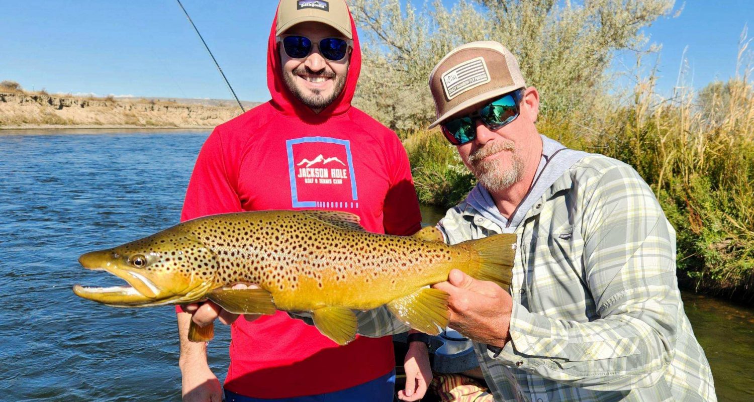 Ugly Bug Guide: Andy Brust and his client with a beautful brown trout.
